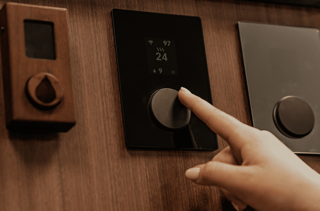 Adjusting thermostat in sauna