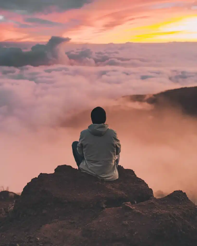 Meditating on top of a mountain