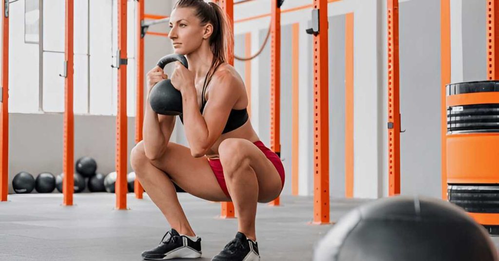 An athlete performing a goblet squat